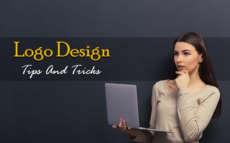 woman holding laptop thinking of logo design