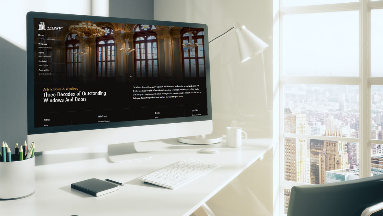 Artistic Doors & Windows website on a desktop computer