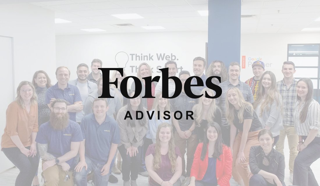 Forbes Advisor logo over the SmartSites team at the New Jersey office