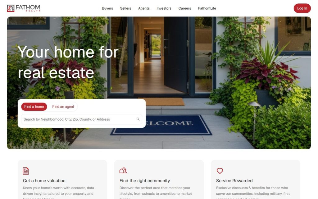 Fathom Realty homepage on a laptop
