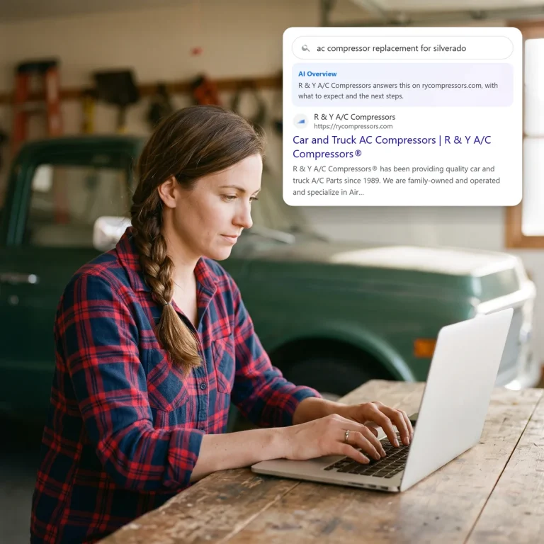 A truck owner searching on her laptop and finding R & Y A/C Compressors in the search and AI results