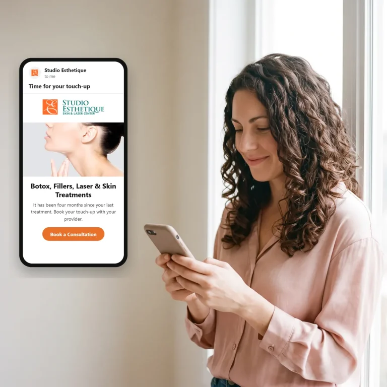 A client reading an email from Studio Esthetique on her phone