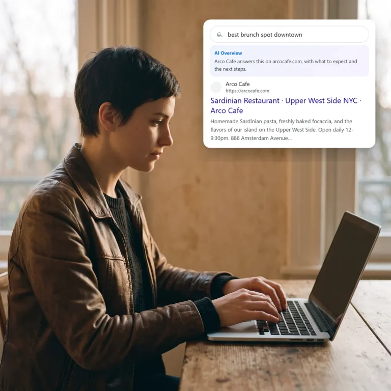 A diner searching on her laptop and finding Arco Cafe in the search and AI results