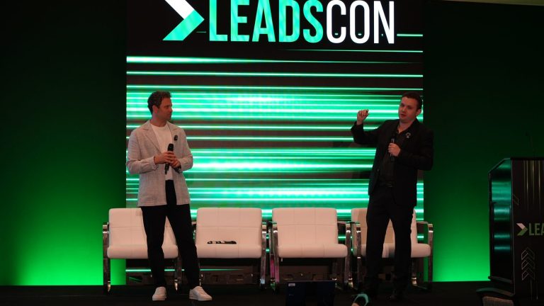 Michael Melen and Dr. Alex Rubinov on stage at LeadsCon Las Vegas 2026