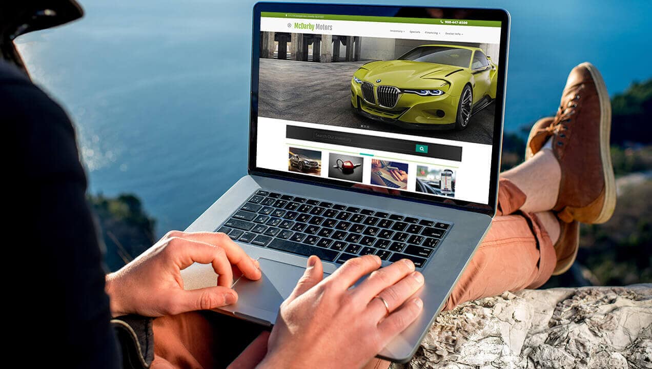 McDarby Motors website on laptop