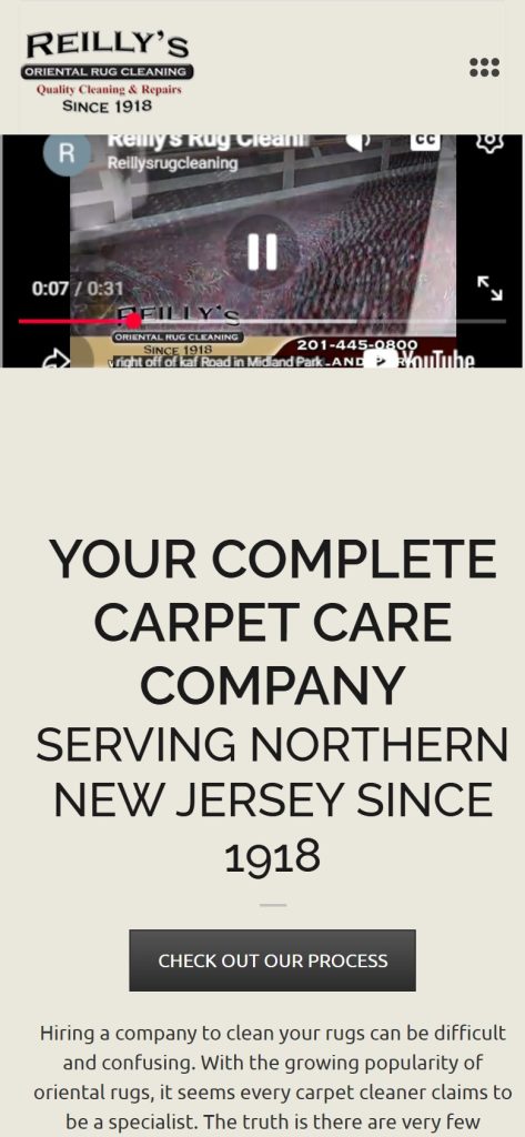 Reilly’s Oriental Rug Cleaning homepage on a phone