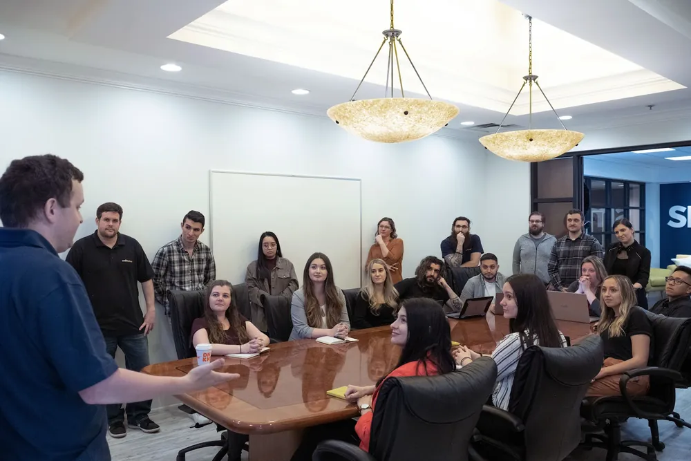 SmartSites all-hands meeting around the conference table