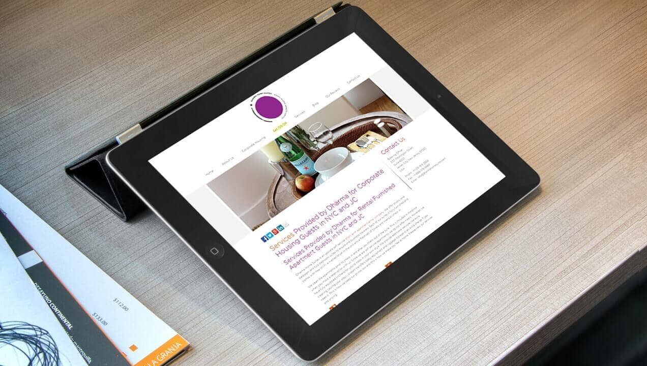 Dharma Home Suites website on tablet